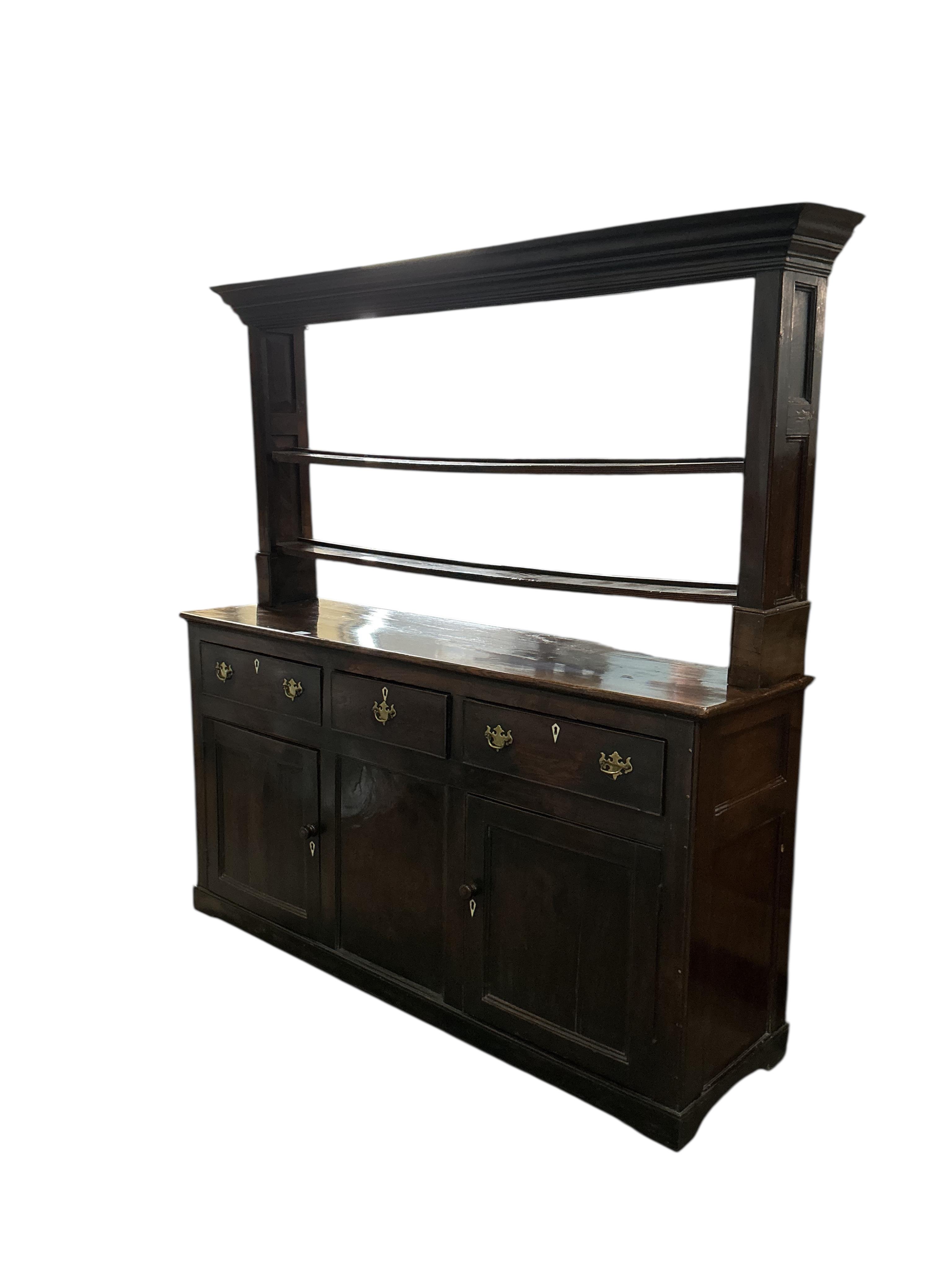 An 18th century oak dresser with open rack, (back boards wormed), width 170cm, depth 47cm, height 182cm